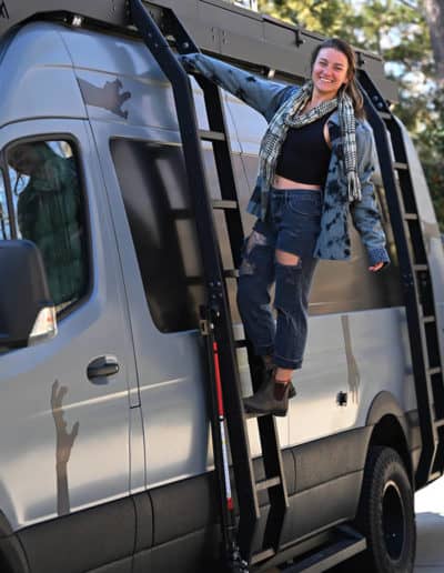 Megan climbs the van